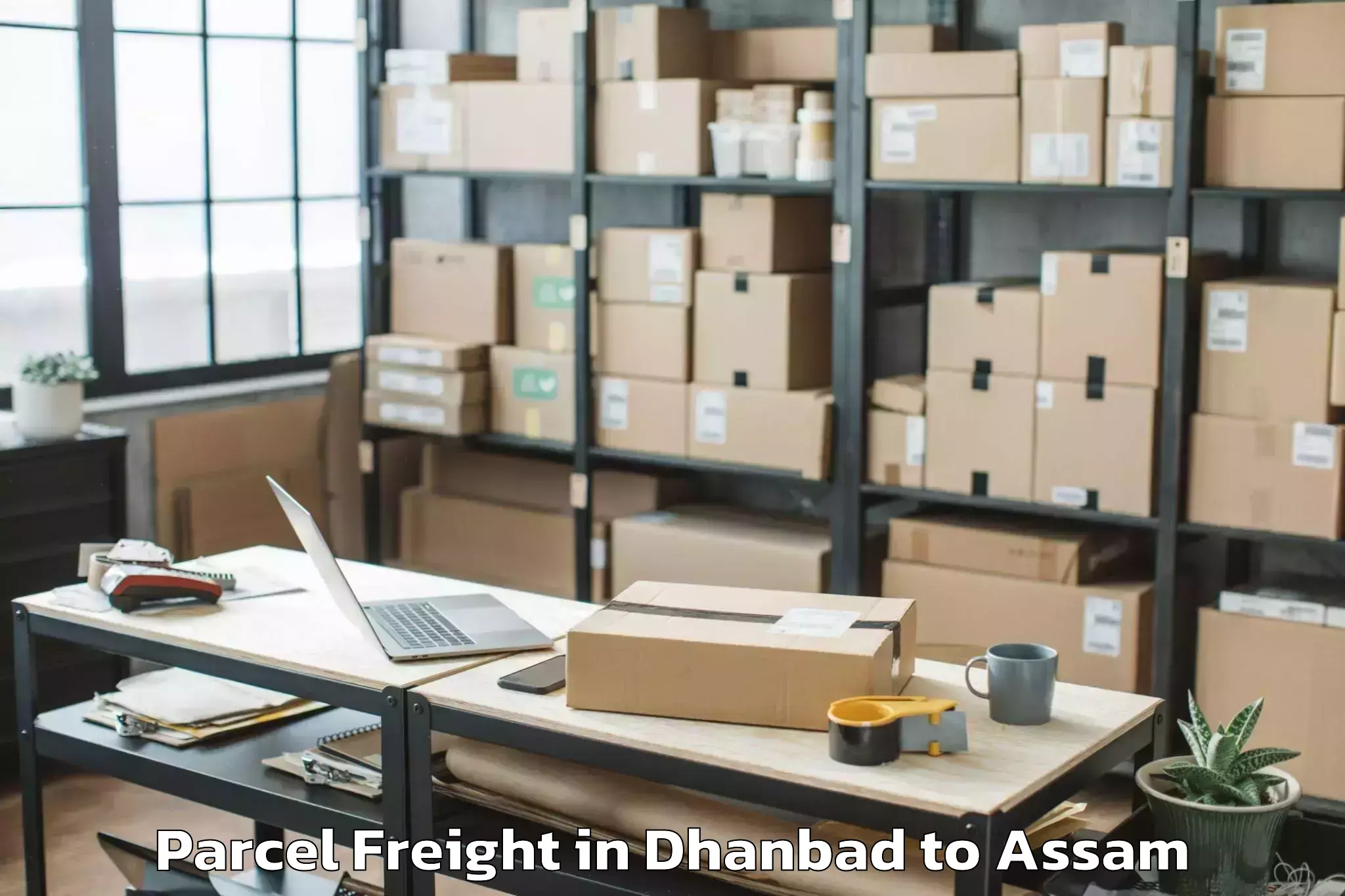 Leading Dhanbad to Dergaon Parcel Freight Provider